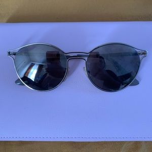 Silver Prada reflecting sunglasses